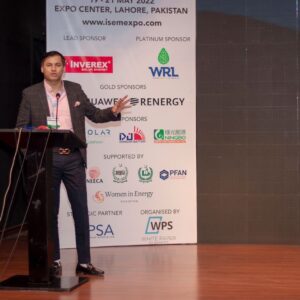 Hashim Raza delivering a speech at a corporate event.